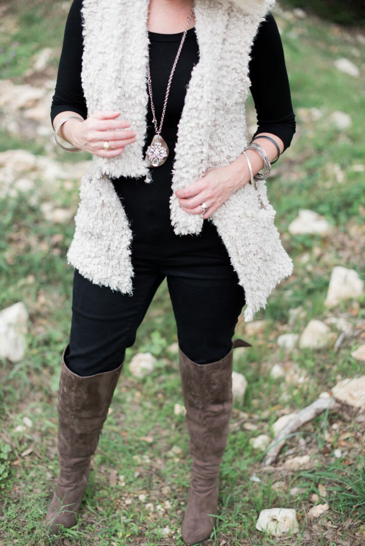 Styling a fur vest with over-the-knee boots